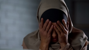 Photo of an upset woman covering her face with her hands. Depression can be overwhelming. Learn how depression therapy in Atlanta, GA can help provide you with support from an online depression therapist.