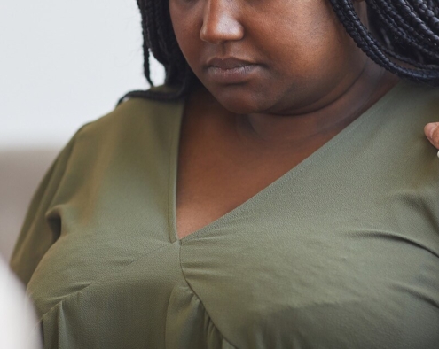 Photo of a sad woman speaking looking down. Are you struggling to manage your depression symptoms. Learn about depression and how depression therapy in Atlanta, GA can help you manage your symptoms in a healthy way.