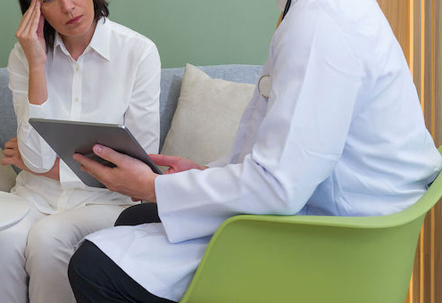 Photo of a woman sitting with a doctor looking stressed. Are you struggling with your health anxiety? Discover how anxiety therapy in Atlanta, GA can help you begin managing your symptoms and support you.