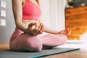 Photo of a woman sitting on a yoga mat practicing meditation. If you are struggling to manage your anxiety symptoms, find new places that can help calm your symptoms. Learn to find more support with anxiety therapy in Atlanta, GA.