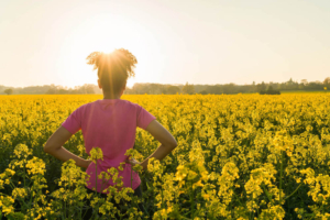 Photo of an African American woman standing in a field with her hands on her hips looking at the sunset. Stress can be difficult to alleviate alone. Learn how therapy for stress in Atlanta, GA can help you begin managing your symptoms.