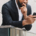 Photo of an anxious man looking at his phone. Learn to manage life transitions more effectively with the help of anxiety therapy in Atlanta, GA.