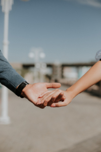 A close up of a couple holding hands on a sunny day. This could represent the support offered for partners with an anxiety disorder. Search for anxiety therapy in Atlanta, GA for more info about online anxiety therapy in Atlanta, GA. Contact an anxiety therapist Atlanta, GA to learn more. 