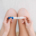 A woman holds a positive pregnancy test, reflecting mixed emotions of hope and fear while seeking postpartum therapy in Atlanta, GA, postpartum counseling Atlanta, postpartum anxiety treatment Atlanta, and Alpharetta postpartum anxiety treatment.