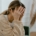 A young woman sits on a couch with her hands covering her face, visibly overwhelmed and distressed. This emotional moment may reflect the experience of postpartum rage in Atlanta, GA — a common but often overlooked response in the postpartum period. Support from a postpartum therapist in Atlanta, GA can help those facing intense emotional shifts. Alpharetta postpartum anxiety treatment offers a safe space to process these difficult feelings.