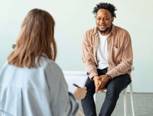 psychologist and client | grief therapist in atlanta, ga | grief counseling in atlanta, ga | online grief counseling in atlanta, ga | atlanta, ga Client talks with a clinician in a calm office, reflecting on grief and adjustment. A skilled grief therapist in atlanta, ga provides individualized grief counseling in atlanta, ga and integrated anxiety therapy in atlanta, ga to rebuild resilience.